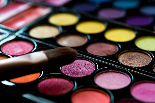 make-up eye-shadow palette with eye-shadow brush. Selective focus